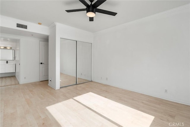 4426 Ventura Canyon Ave Unit 204, Sherman Oaks, CA 91423 - unfurnished bedroom with light wood finished floors, connected bathroom, a closet, crown molding, and ceiling fan