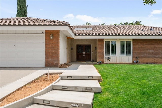 732 Hilary Ln, Redlands, CA 92373 - ranch-style home with brick siding, french doors, a front lawn, a tile roof, and an attached garage