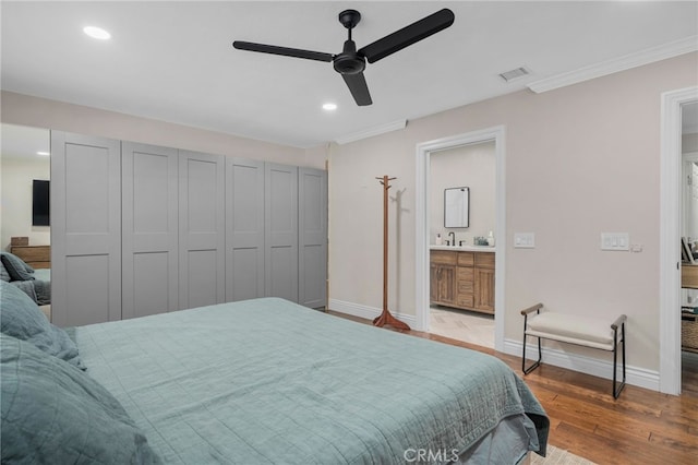 732 Hilary Ln, Redlands, CA 92373 - bedroom with wood finished floors, baseboards, a sink, recessed lighting, and ensuite bathroom