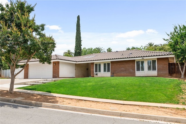 732 Hilary Ln, Redlands, CA 92373 - ranch-style home featuring a tiled roof, a garage, concrete driveway, and brick siding