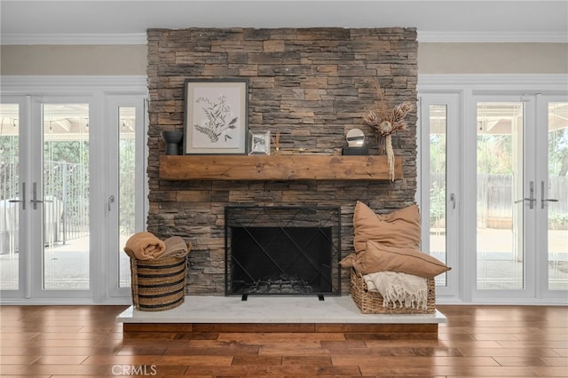 732 Hilary Ln, Redlands, CA 92373 - living area with french doors, wood finished floors, a stone fireplace, and crown molding