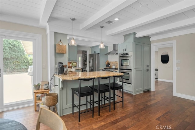 732 Hilary Ln, Redlands, CA 92373 - kitchen featuring stainless steel appliances, wall chimney exhaust hood, a peninsula, dark wood-style floors, and beamed ceiling