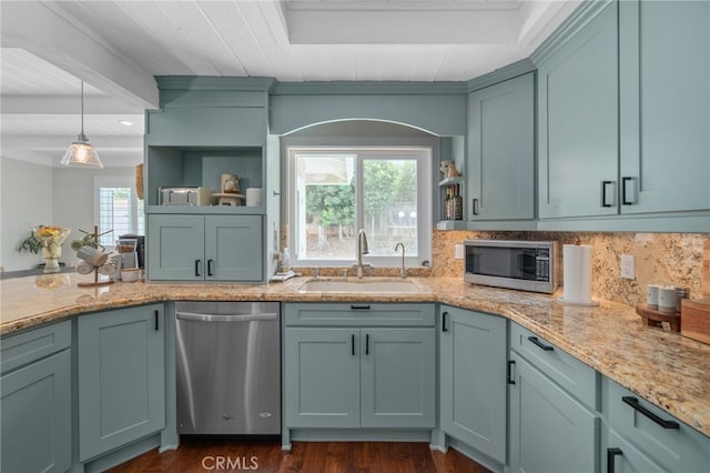 732 Hilary Ln, Redlands, CA 92373 - kitchen with stainless steel appliances, a sink, light stone counters, decorative backsplash, and hanging light fixtures
