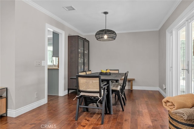 732 Hilary Ln, Redlands, CA 92373 - dining area featuring healthy amount of natural light, crown molding, dark wood-type flooring, and baseboards