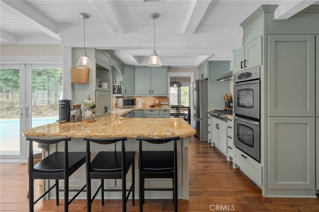 732 Hilary Ln, Redlands, CA 92373 - kitchen featuring stainless steel appliances, beam ceiling, a peninsula, under cabinet range hood, and light stone counters