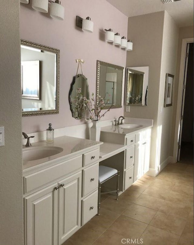 639 Burnt Ranch Way, Chico, CA 95973 - bathroom with two vanities and tile patterned floors