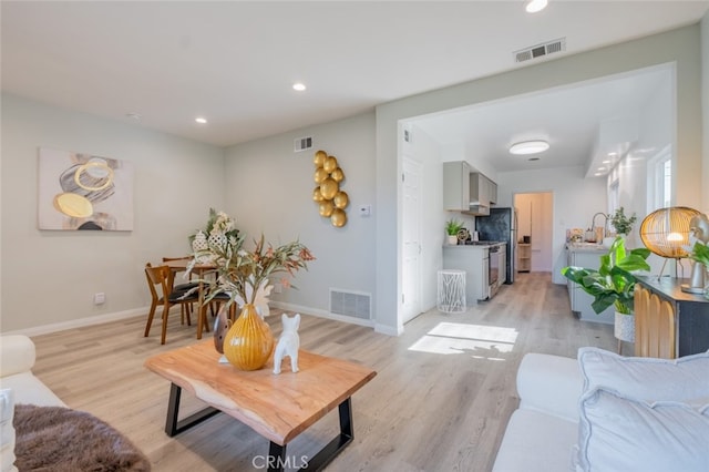 244 N Hollywood Way, Burbank, CA 91505 - living area with light wood-style floors, baseboards, and recessed lighting