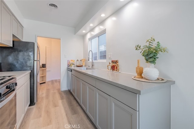 244 N Hollywood Way, Burbank, CA 91505 - kitchen with a sink, appliances with stainless steel finishes, light wood-style floors, recessed lighting, and light countertops