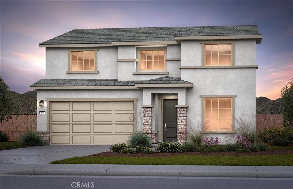 4613 Goldfinch St, Hemet, CA 92545 - view of front of home featuring driveway, an attached garage, stone siding, and stucco siding