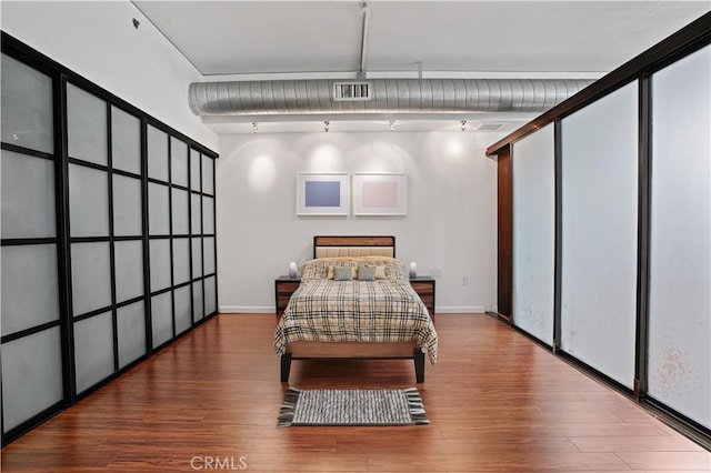 1111 S Grand Ave Unit 702, Los Angeles, CA 90015 - bedroom with wood finished floors