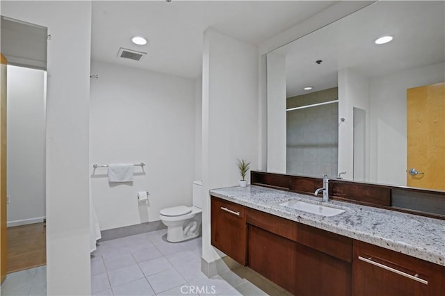 1111 S Grand Ave Unit 702, Los Angeles, CA 90015 - full bath featuring vanity, toilet, a shower, tile patterned floors, and recessed lighting
