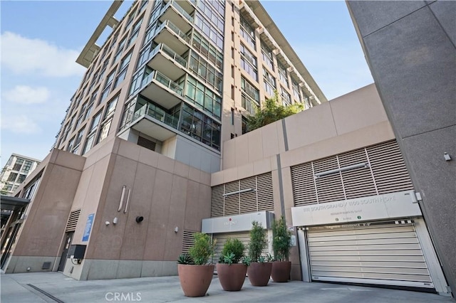 1111 S Grand Ave Unit 702, Los Angeles, CA 90015 - view of building exterior with an attached garage