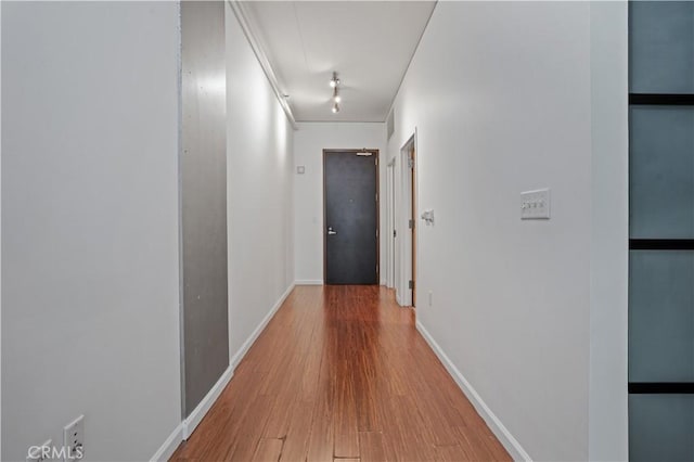 1111 S Grand Ave Unit 702, Los Angeles, CA 90015 - hallway featuring wood finished floors and baseboards