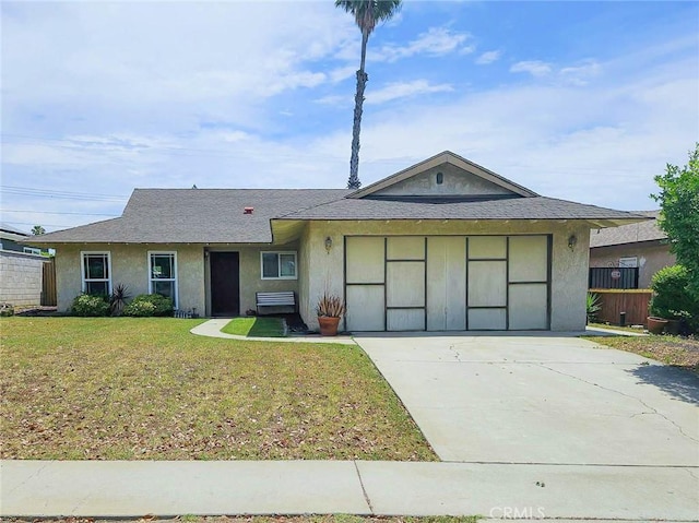 7121 Lion St, Rancho Cucamonga, CA 91701 - ranch-style home with stucco siding, concrete driveway, a front lawn, a garage, and roof with shingles
