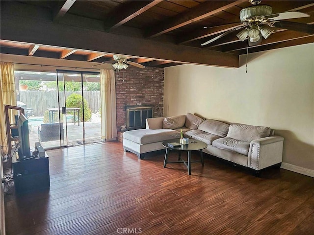 7121 Lion St, Rancho Cucamonga, CA 91701 - living room featuring a ceiling fan, beamed ceiling, wood finished floors, baseboards, and a brick fireplace