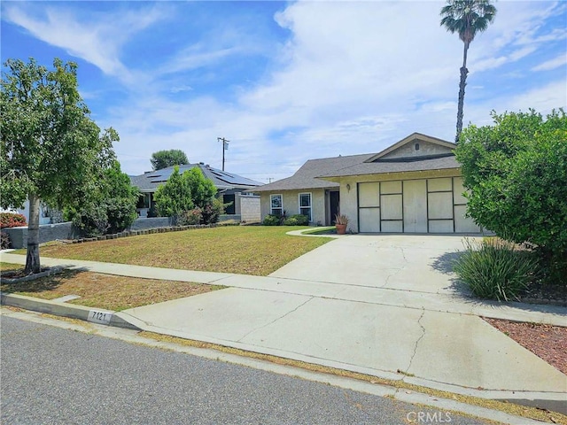 7121 Lion St, Rancho Cucamonga, CA 91701 - ranch-style house with concrete driveway, a front lawn, stucco siding, and a garage
