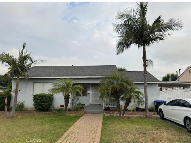 13538 Lukay St, Whittier, CA 90605 - single story home featuring a front lawn, roof with shingles, and stucco siding