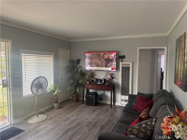 13538 Lukay St, Whittier, CA 90605 - living area featuring a heating unit, wood finished floors, and crown molding