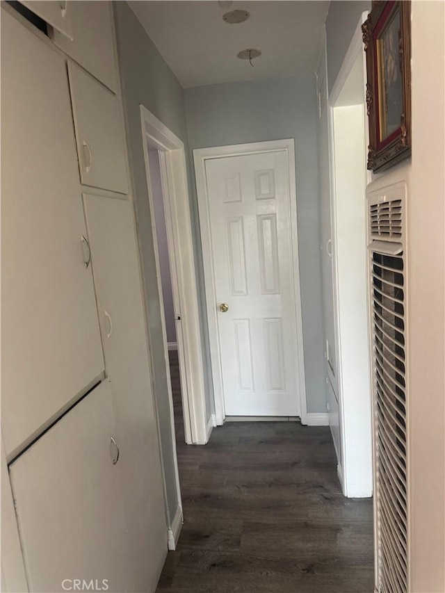 13538 Lukay St, Whittier, CA 90605 - hallway with a heating unit and dark wood finished floors