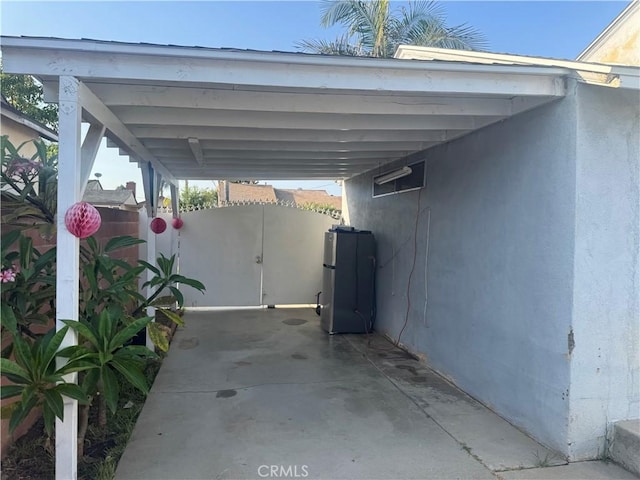 13538 Lukay St, Whittier, CA 90605 - view of vehicle parking with a carport and a gate