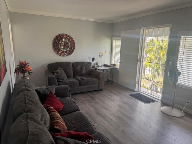 13538 Lukay St, Whittier, CA 90605 - living room featuring wood finished floors, healthy amount of natural light, and ornamental molding