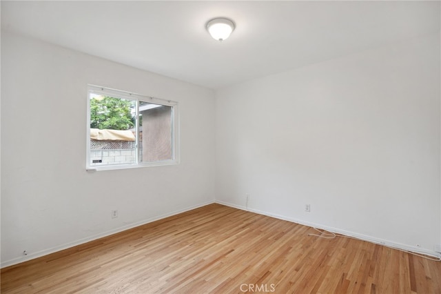 6515 Amigo Ave, Reseda, CA 91335 - empty room with light wood-style flooring and baseboards