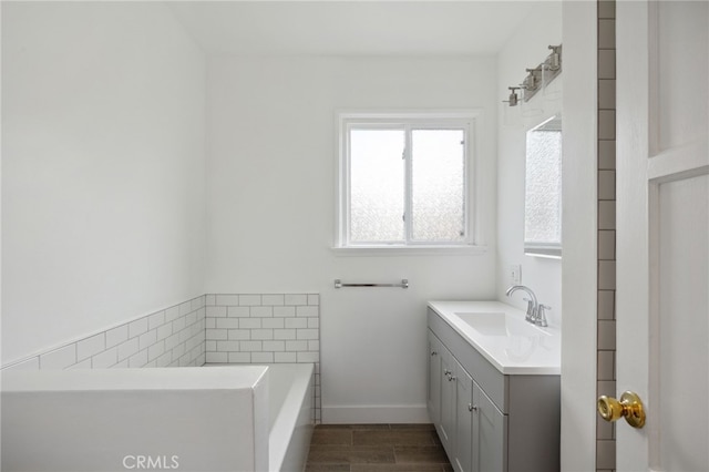 6515 Amigo Ave, Reseda, CA 91335 - full bathroom with vanity, plenty of natural light, a bath, and baseboards