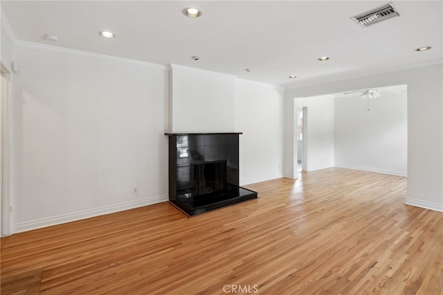 6515 Amigo Ave, Reseda, CA 91335 - unfurnished living room with ornamental molding, a multi sided fireplace, light wood-type flooring, recessed lighting, and baseboards