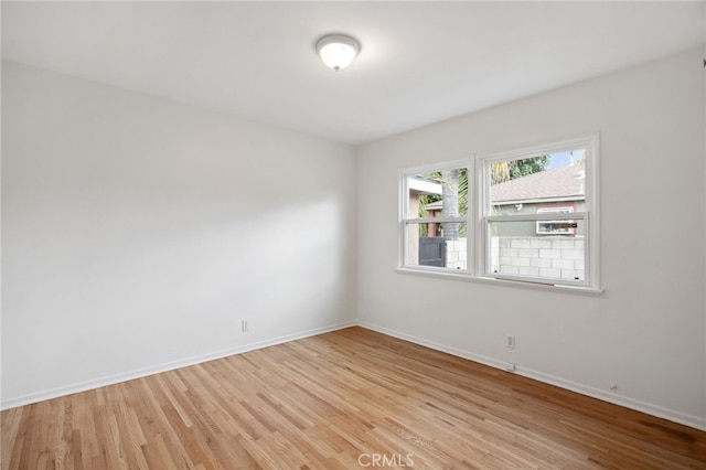 6515 Amigo Ave, Reseda, CA 91335 - empty room featuring light wood-style floors and baseboards