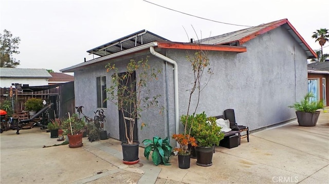 13912 Daventry St, Pacoima, CA 91331 - view of side of home with a patio area and stucco siding
