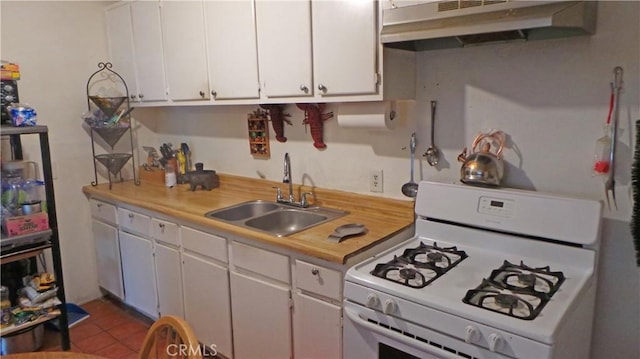 13912 Daventry St, Pacoima, CA 91331 - kitchen with white range with gas stovetop, under cabinet range hood, a sink, light countertops, and white cabinetry