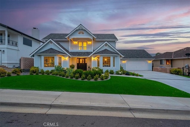 233 Elaine Way, Pismo Beach, CA 93449 - view of front facade featuring a balcony, driveway, a yard, and a garage