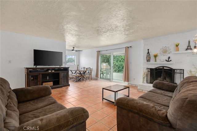 510 Archibald Ct, Colton, CA 92324 - living area with light tile patterned flooring, ceiling fan, a brick fireplace, and a textured ceiling