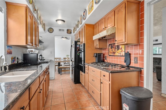 510 Archibald Ct, Colton, CA 92324 - kitchen with a sink, black appliances, light tile patterned floors, under cabinet range hood, and a warming drawer