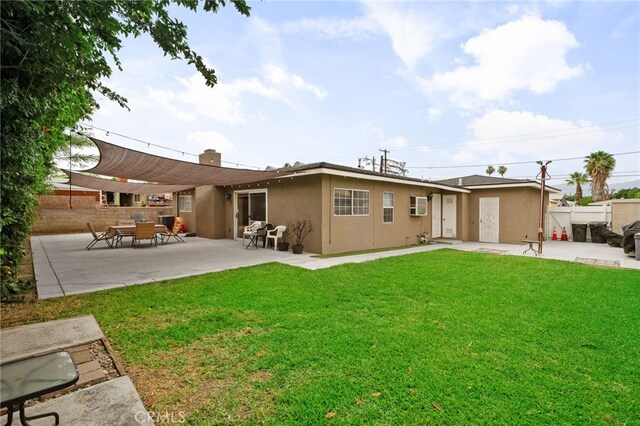 510 Archibald Ct, Colton, CA 92324 - rear view of property with stucco siding, a patio, and an AC wall unit