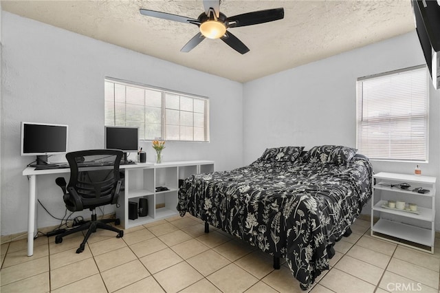 510 Archibald Ct, Colton, CA 92324 - bedroom featuring tile patterned flooring, a textured ceiling, an office area, and a ceiling fan