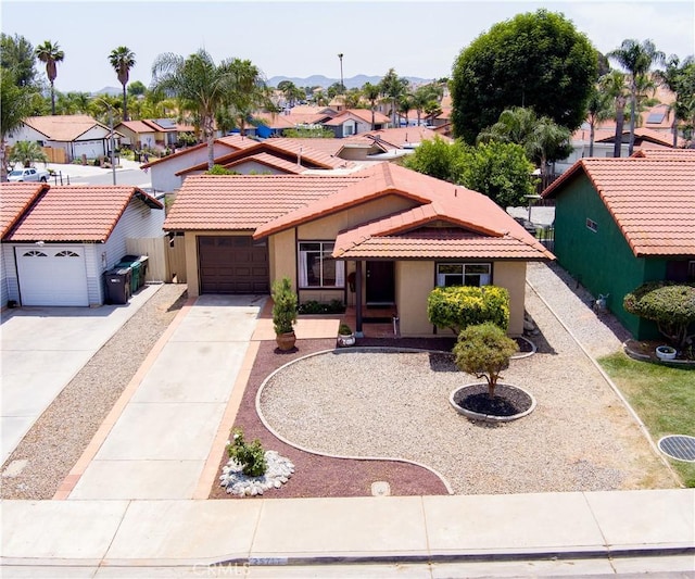 25717 Leah Ln, Menifee, CA 92586 - view of front of house with a residential view, stucco siding, a tile roof, and concrete driveway