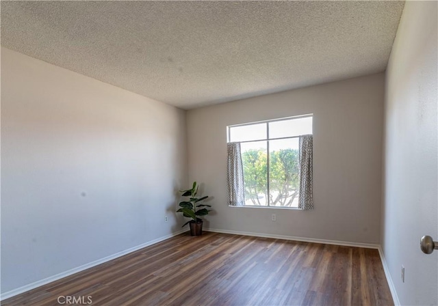 25717 Leah Ln, Menifee, CA 92586 - unfurnished room with dark wood finished floors, a textured ceiling, and baseboards