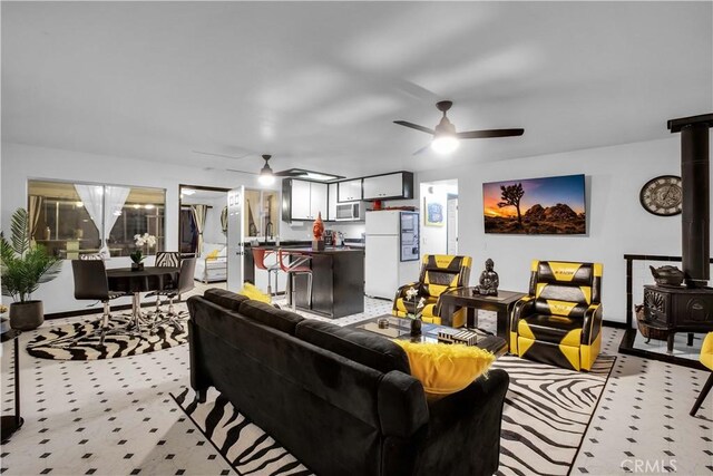 49490 Big Morongo Canyon Rd, Morongo Valley, CA 92256 - living room with ceiling fan and a wood stove