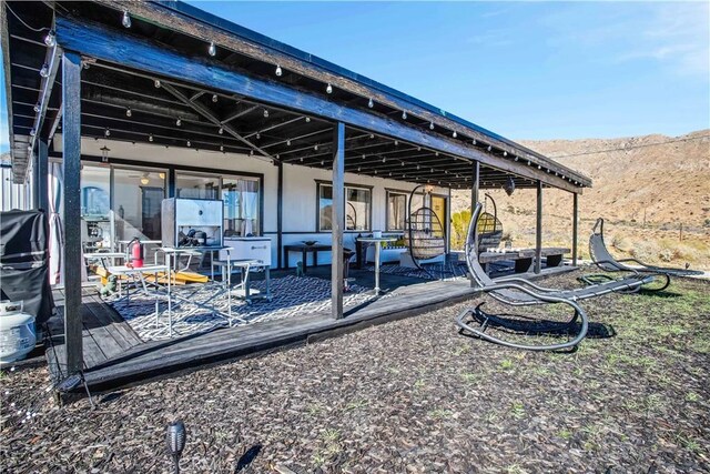 49490 Big Morongo Canyon Rd, Morongo Valley, CA 92256 - view of patio featuring a deck with mountain view