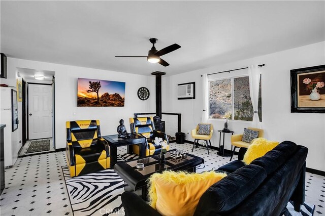 49490 Big Morongo Canyon Rd, Morongo Valley, CA 92256 - living area with baseboards, ceiling fan, and a wood stove