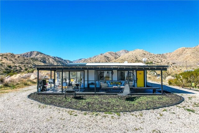 49490 Big Morongo Canyon Rd, Morongo Valley, CA 92256 - view of front of home featuring a mountain view and a patio