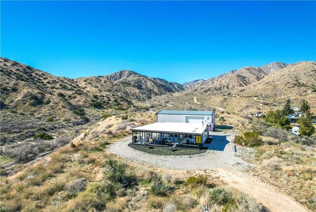 49490 Big Morongo Canyon Rd, Morongo Valley, CA 92256 - back of property featuring gravel driveway and a mountain view