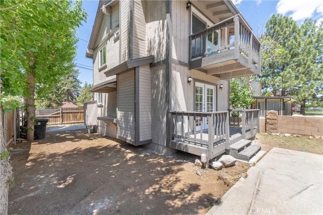 2100 1st Ln, Big Bear City, CA 92314 - view of property exterior featuring a balcony and french doors