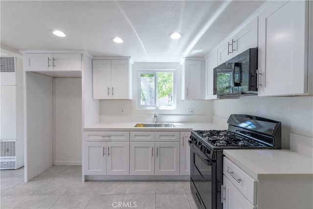2100 1st Ln, Big Bear City, CA 92314 - kitchen with black appliances, a heating unit, a sink, white cabinets, and recessed lighting