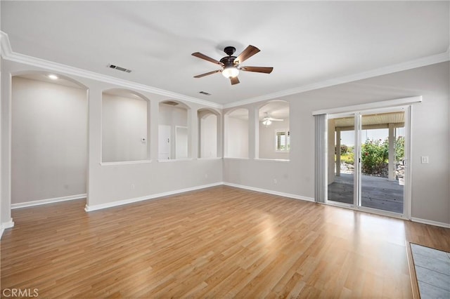 28216 Meadowsweet Dr, Menifee, CA 92584 - unfurnished room featuring a ceiling fan, baseboards, light wood-style flooring, ornamental molding, and arched walkways