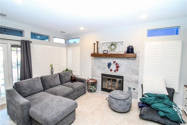 7223 Yarnell Rd, Highland, CA 92346 - living area featuring healthy amount of natural light, a tile fireplace, tile patterned flooring, and recessed lighting