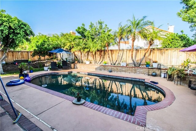 7223 Yarnell Rd, Highland, CA 92346 - view of swimming pool with a fenced backyard and a patio area