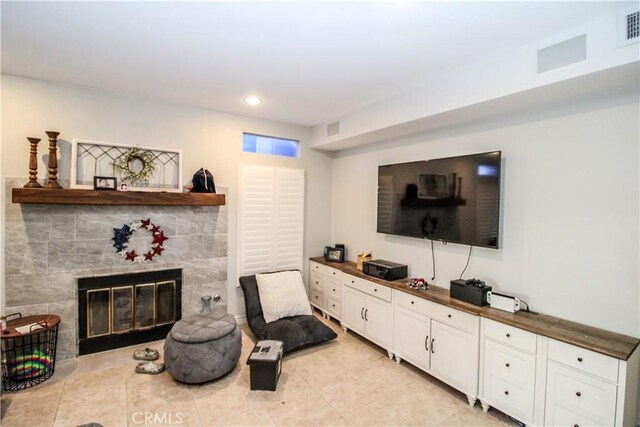 7223 Yarnell Rd, Highland, CA 92346 - living area with light tile patterned floors, a tile fireplace, and recessed lighting