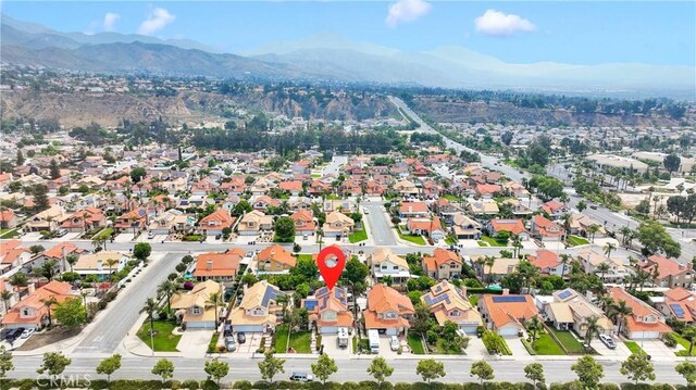 7223 Yarnell Rd, Highland, CA 92346 - aerial view of property and surrounding area featuring mountains and nearby suburban area